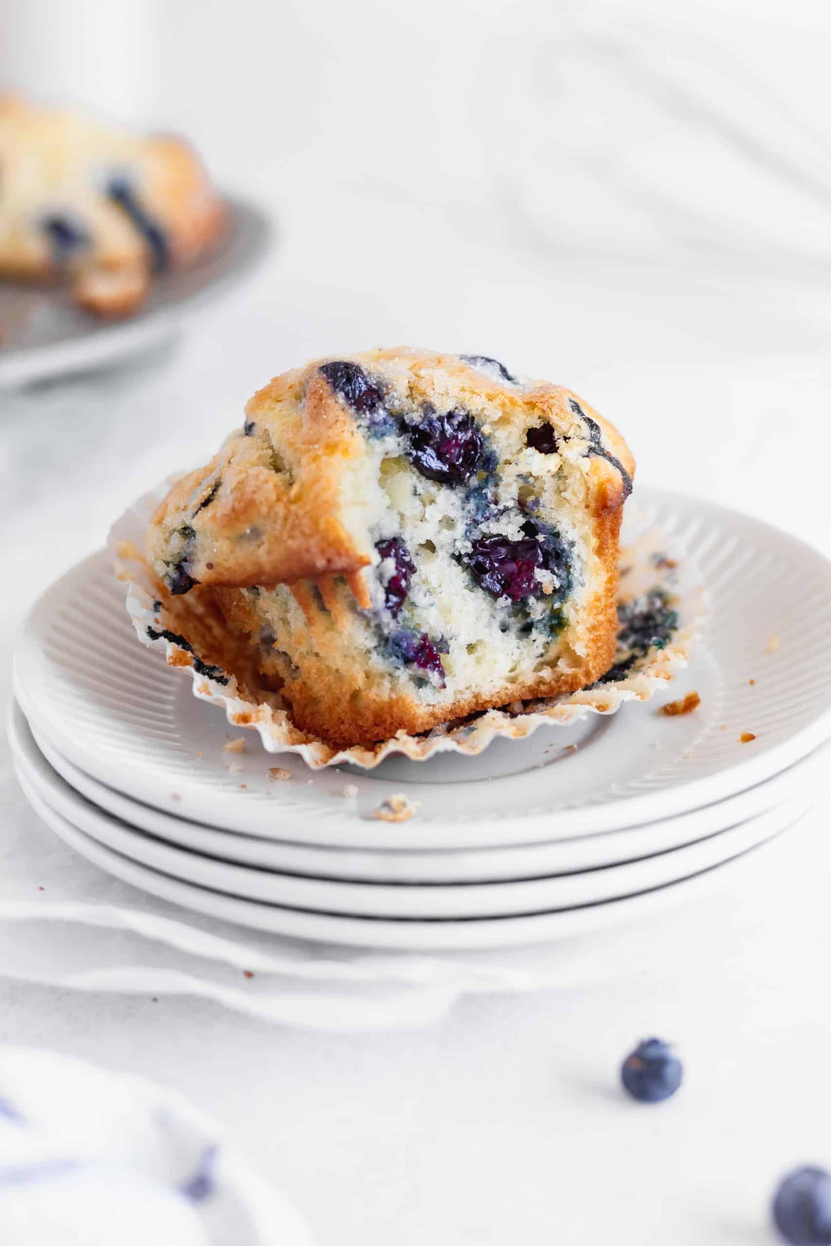 A bitten blueberry muffin