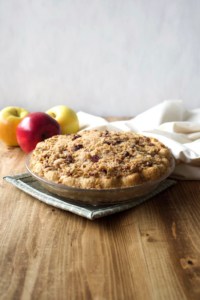 Flaky crust filled with deliciously spiced apples and topped with crunchy oat pecan streusel topping. Can this apple pie get any better? #applepie #oatstreusel #pecans #singlecrust #flaky #piecrust #butter #apples #thanksgiving #christmas #holiday #fall #autumn #winter #dessert #recipe