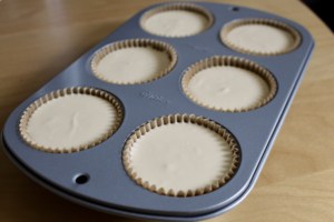 Individual cheesecake batter in the muffin pan