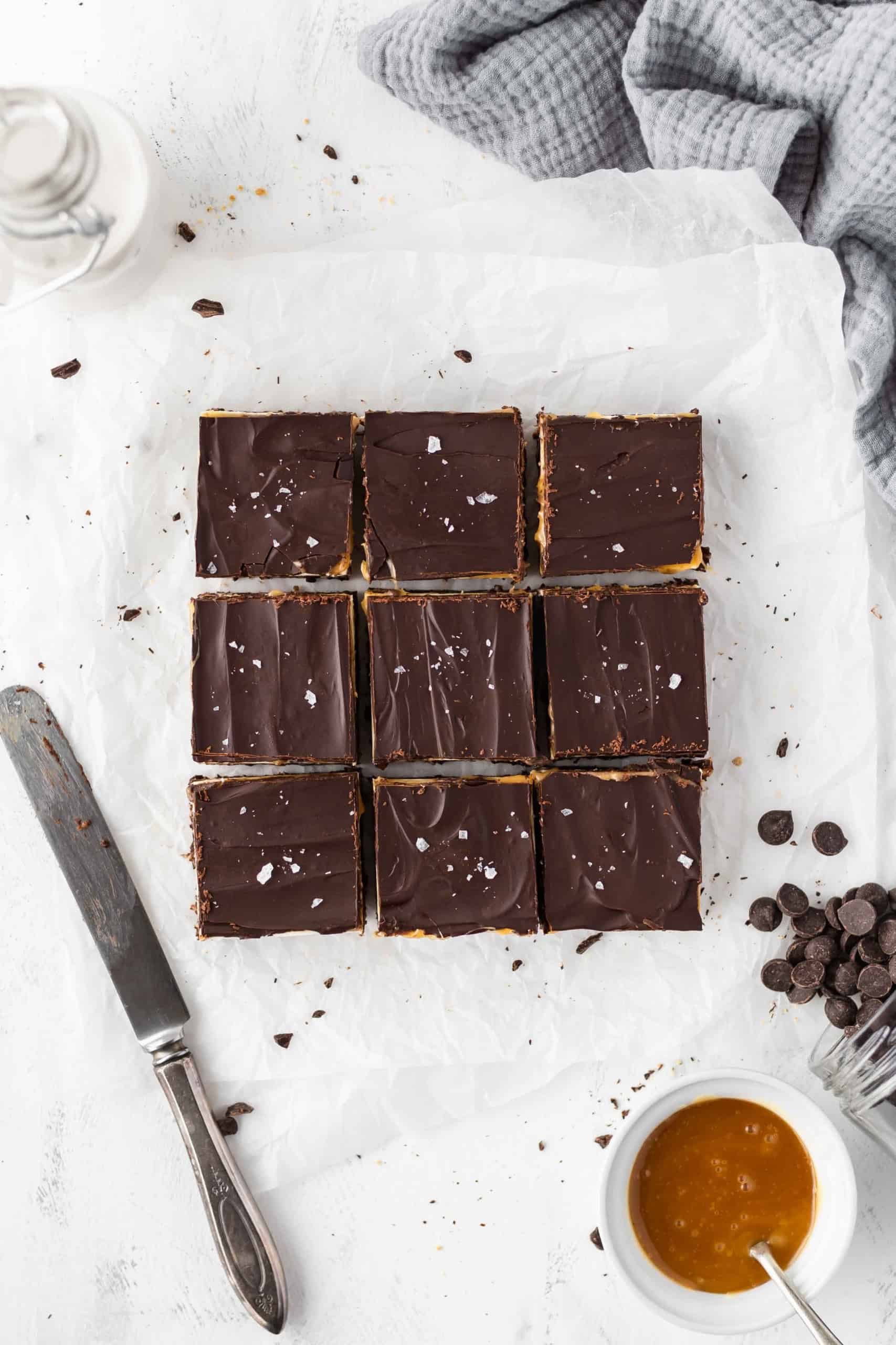 Gluten free Nanaimo bars with a knife