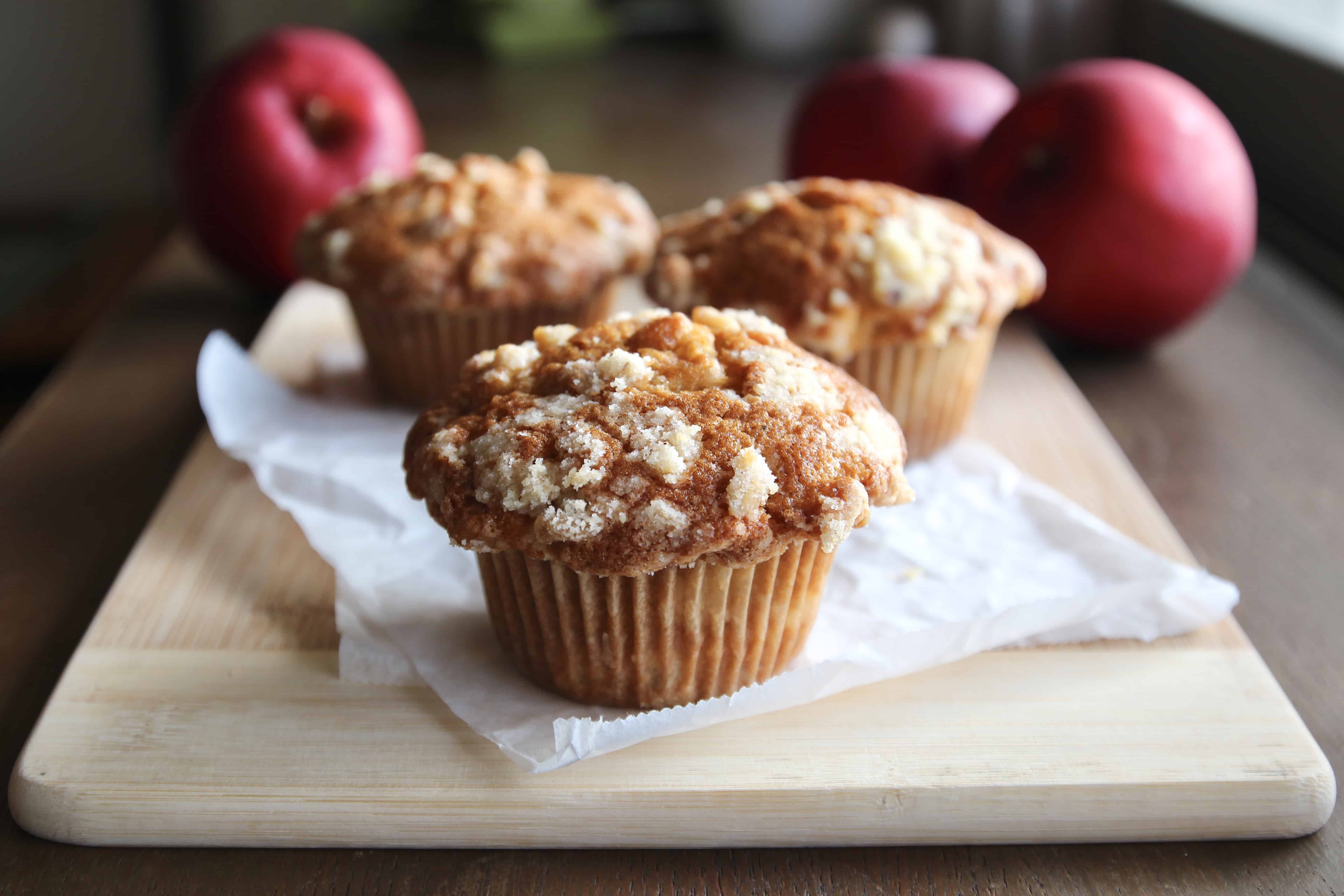 Apple streusel muffins on a wooden board
