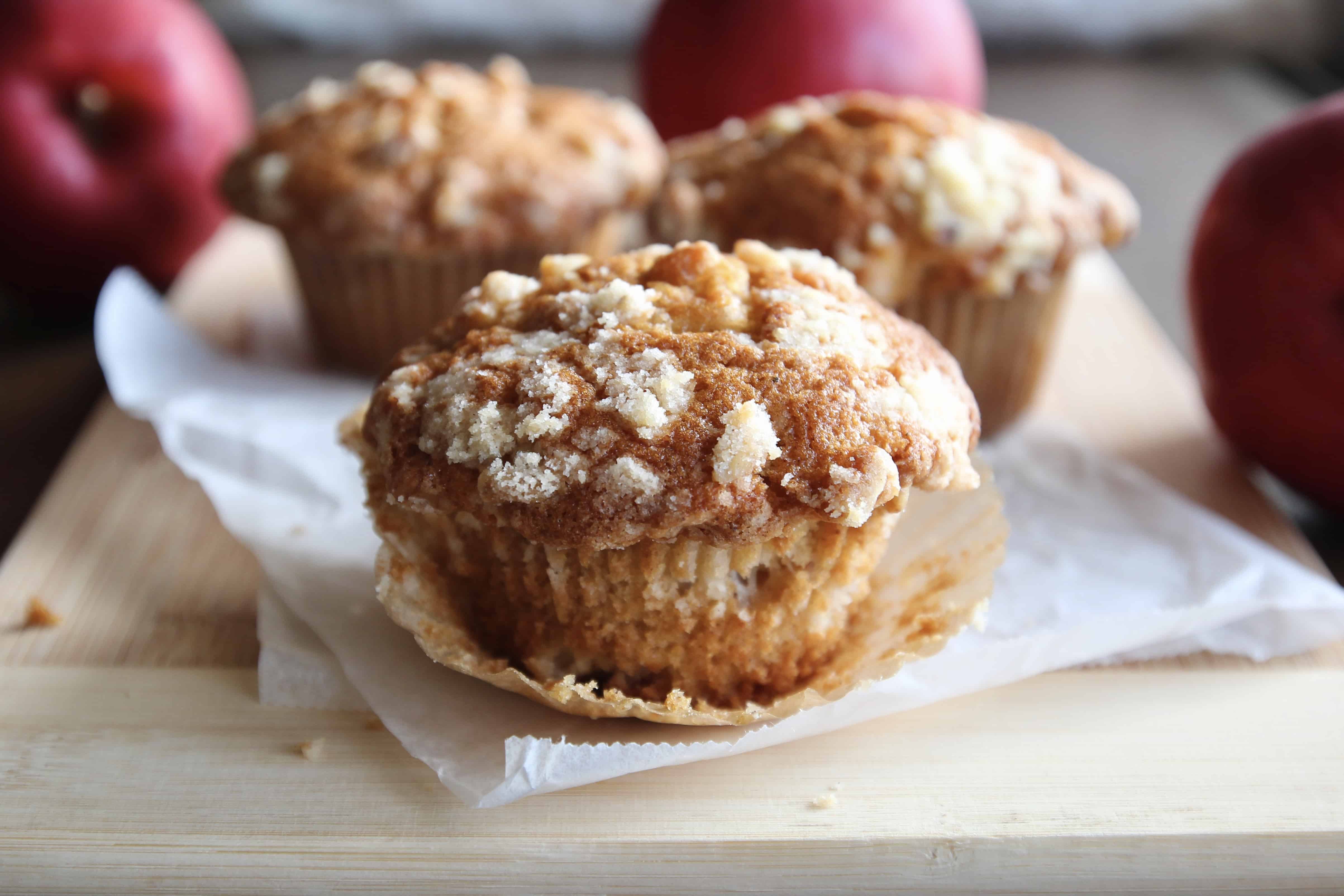Apple streusel muffin with the paper liner peeled
