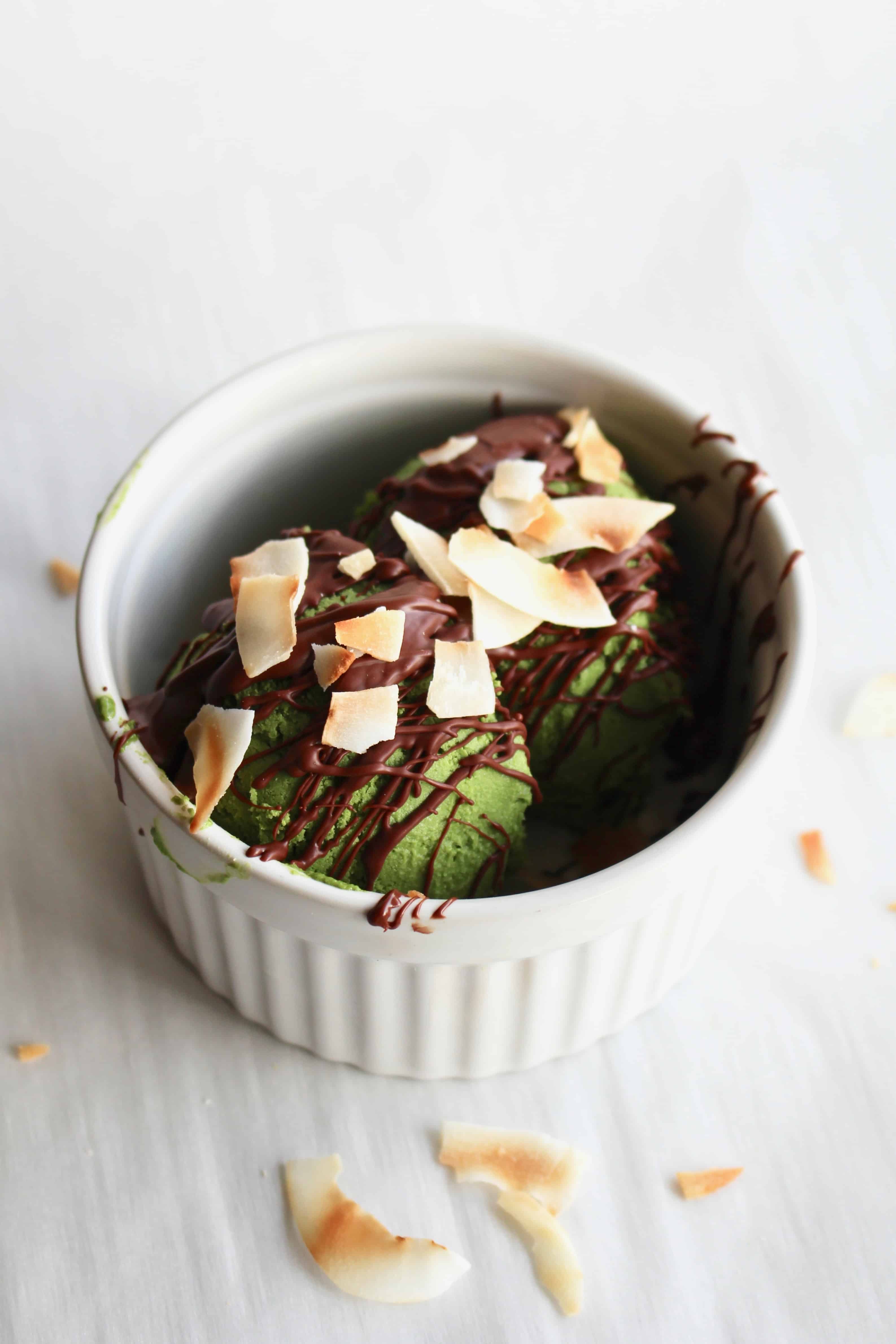 Chocolate and coconut flakes on green ice cream