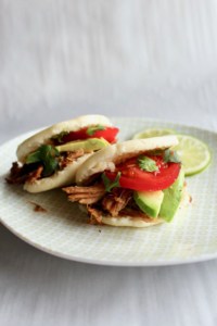 Slow cooker carnitas sandwiched in arepas