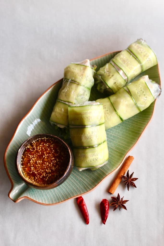 Need a fresh and light appetizer? These spicy chicken summer rolls are perfect! Moist and flavorful chicken is wrapped in rice paper with lettuce and cucumber, served with a spicy Szechuan dipping sauce! #summerrolls #springrolls #ricepaper #chicken #chickenthigh #chinese #szechuan #spicy #healthy #lettucewraps #appetizer #fresh #light #partyfood #asian