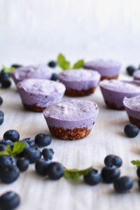 Vegan cheesecake bites frozen in mini muffins pans and unmolded before putting into the fridge