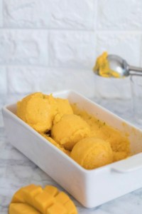 This mango lime sorbet is one of the healthiest and most indulgent desserts for the upcoming hot summer days! Super easy, needing only two ingredients and a food processor! #mango #lime #sorbet #healthy #twoingredient #2ingredient #summer #icecream #nicecream #gelato #frozen #frozendessert