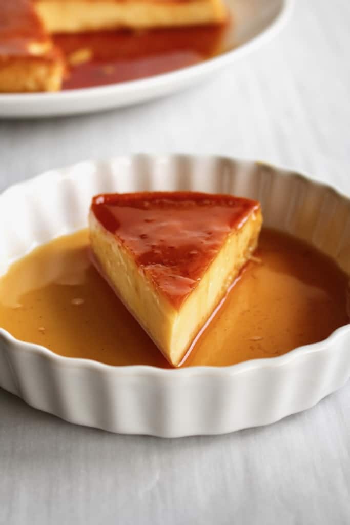 A slice of dairy-free leche flan on a plate