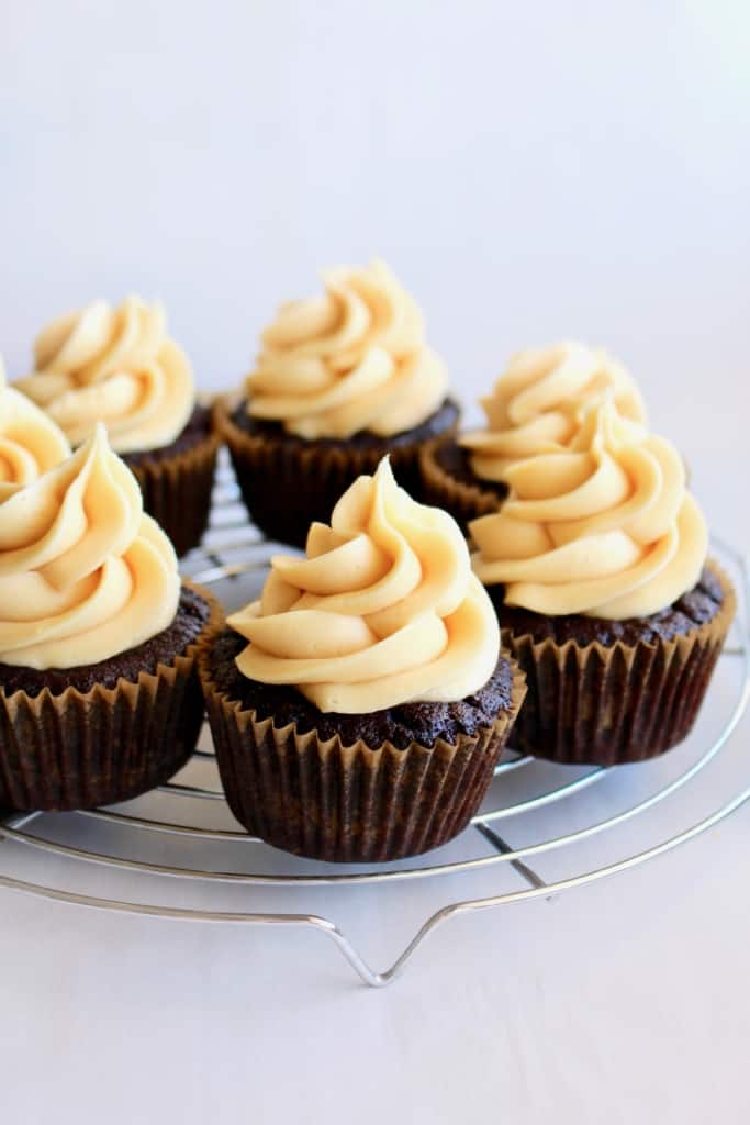 Silky vegan buttercream swirled on moist cupcakes