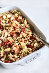 This rice stuffing with jackfruit is truly THE BEST stuffing ever! It’s both vegan and gluten free so everyone can enjoy it, making it perfect for the holidays when you have guests with different dietary restrictions. Full of brown rice, vegetables, cranberries, nuts, and jackfruit confit, there’s so much flavor in this stuffing you won’t be missing the meat! This is sure to be your new go to stuffing recipe for Thanksgiving and Christmas! #rice #ricestuffing #stuffing #thanksgiving #christmas #dinner #glutenfree #vegan #vegetarian #brownrice #easy #jackfruit #meatsubstitute #meatless #holidays #fall #winter #recipe #beststuffing #cranberries #almonds #pecans