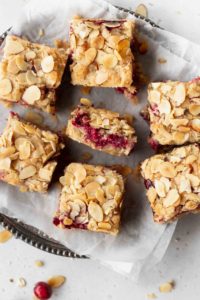 Gluten free and dairy free cranberry bars with sliced almonds
