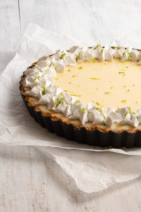 This vegan key lime pie is so creamy and tangy! With a crunchy graham cracker crust on the bottom and topped with rich coconut whipped cream, this plant based dessert won’t have you missing the traditional key lime pie! #vegandessert #vegankeylimepie #keylimepie #nobakedessert #nobakepie #plantbaseddessert
