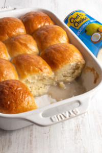 If you need a change from your regular homemade bread rolls, make vegan pani popo! These Samoan sweet coconut milk buns are baked in a yummy coconut sauce! #veganbread #panipopo #coconutmilk #milkbread #homemadebread