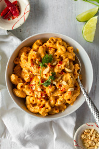 Vegan mac n cheese gets a Thai twist with the addition of spicy red curry paste and zesty tangy lime!