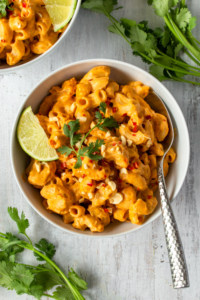 Vegan mac n cheese gets a Thai twist with the addition of spicy red curry paste and zesty tangy lime!