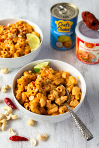 This vegan red curry mac and cheese is comfort food with a kick! The addition of Thai red curry paste and lime juice gives this creamy vegan mac and cheese a spicy tang! #thaicurry #redcurry #vegan #macandcheese #macncheese #vegancheese
