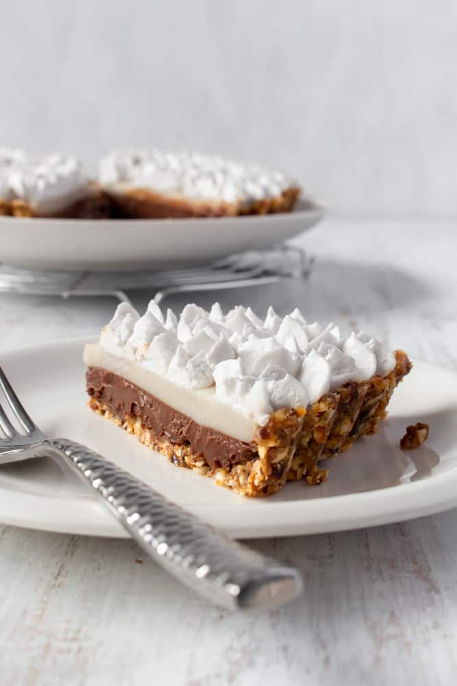 Vegan chocolate haupia pie is a plant-based version of the classic Hawaiian dessert by Ted’ Bakery! Gluten-free, creamy, silky, and no-bake, it’s the perfect make ahead dessert for a summer BBQ! #chocolatepie #haupia #hawaiian #vegandessert #glutenfree #nobake