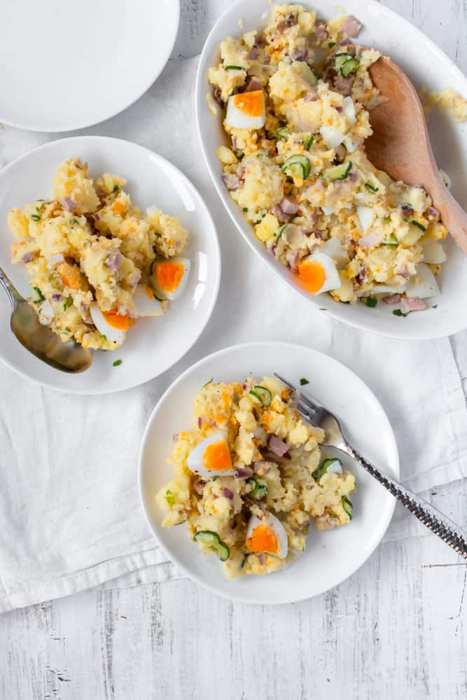 The best potato salad is creamy with a good balance of salt and acidity. My favorite potato salad recipe is low on mayo, dairy-free, and gluten-free! Take out the ham and eggs, and use vegan mayo to make this a vegan potato salad!