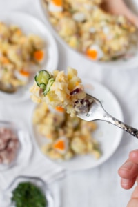 The best potato salad is creamy with a good balance of salt and acidity. My favorite potato salad recipe is low on mayo, dairy-free, and gluten-free! Take out the ham and eggs, and use vegan mayo to make this a vegan potato salad!