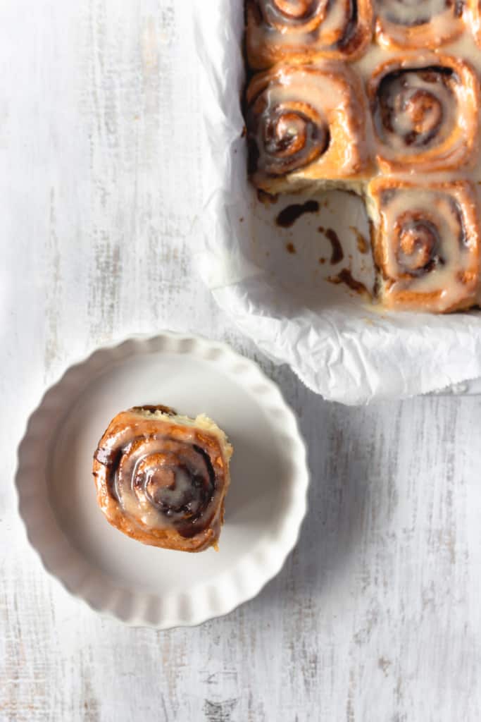 These vegan cinnamon rolls are super easy to make! So fluffy and topped with a cashew cream cheese icing, these vegan cinnamon buns are loved by everyone! #vegancinnamonrolls #cinnamonrolls #cinnamonbuns #veganrecipe #easyrecipe