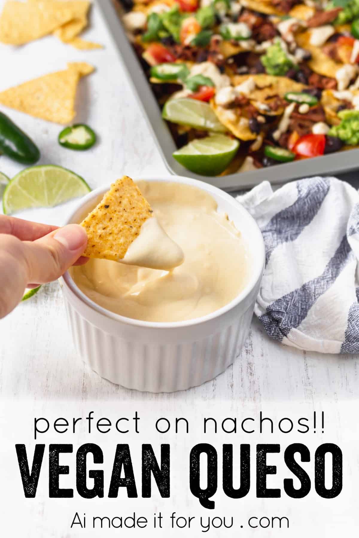 Pulled Jackfruit Nachos with Cheesy Vegan Queso 13 A festive platter of vegan nachos with jackfruit, beans, and creamy queso, garnished with vibrant fresh ingredients.