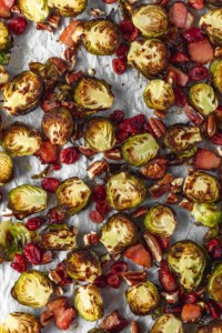 Brussels sprouts get a bad rap for being stinky or mushy, but not when you cook it in the oven with bacon until it get crispy! #thanksgivingdinner #sidedish #easy #simplefood #bacon