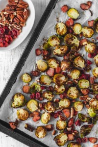 Brussels sprouts get a bad rap for being stinky or mushy, but not when you cook it in the oven with bacon until it get crispy! #thanksgivingdinner #sidedish #easy #simplefood #bacon