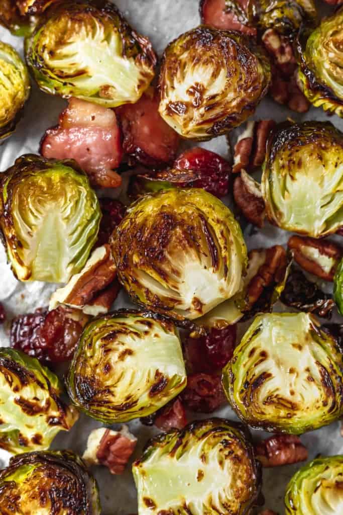 Brussels sprouts get a bad rap for being stinky or mushy, but not when you cook it in the oven with bacon until it get crispy! #thanksgivingdinner #sidedish #easy #simplefood #bacon