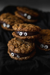 Chocolate fudge sandwiched between two oatmeal cookies make for a delicious and spooky treat!
