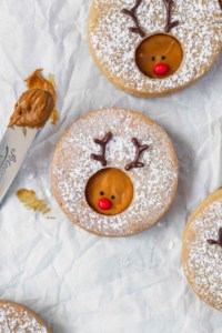 Creamy Biscoff spread is sandwiched between two buttery cookies and decorated to look like Rudolph! Cute and minimalist Christmas cookies! #rudolph #rudolphcookies #christmascookies #cookieexchange