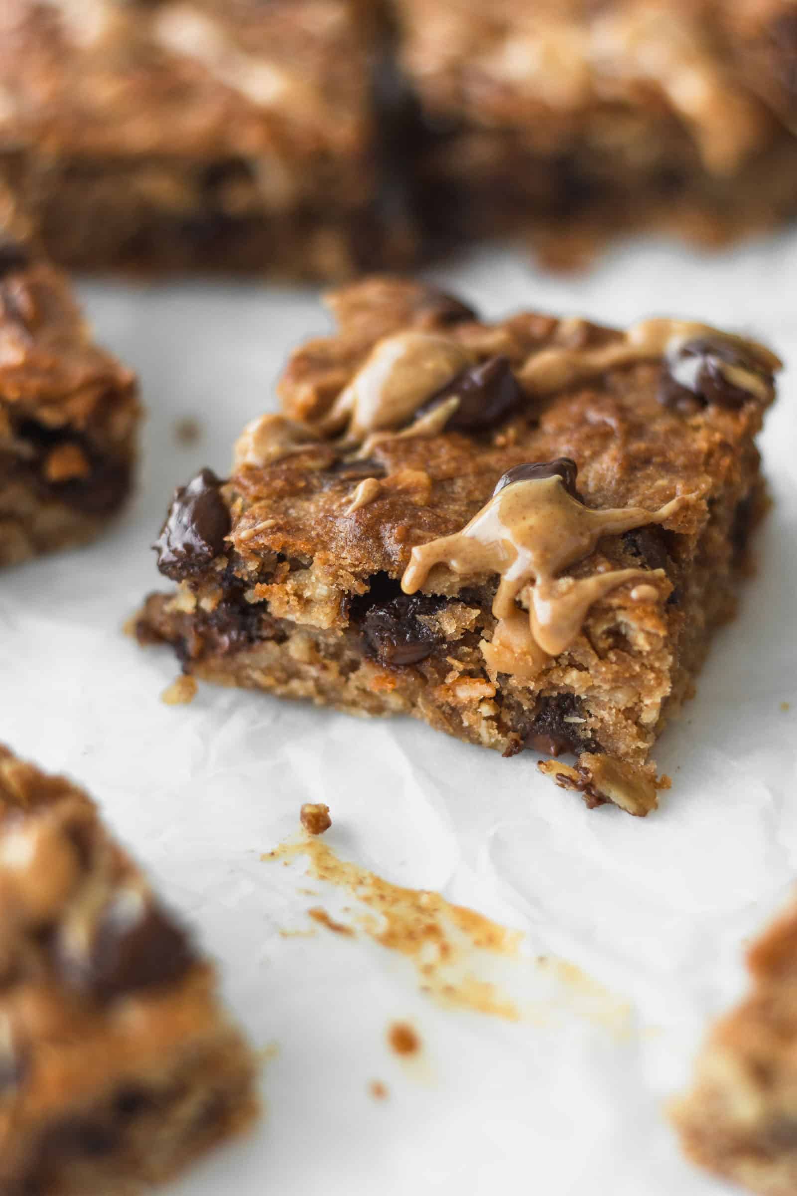 Close up of banana oat bars with chocolate chips and peanut butter