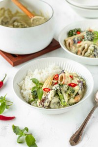 bowl of vegan green curry with mushroom calamari and jasmine rice