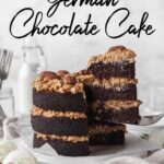 Vertical pin of dairy free German chocolate cake with a slice being taken out.