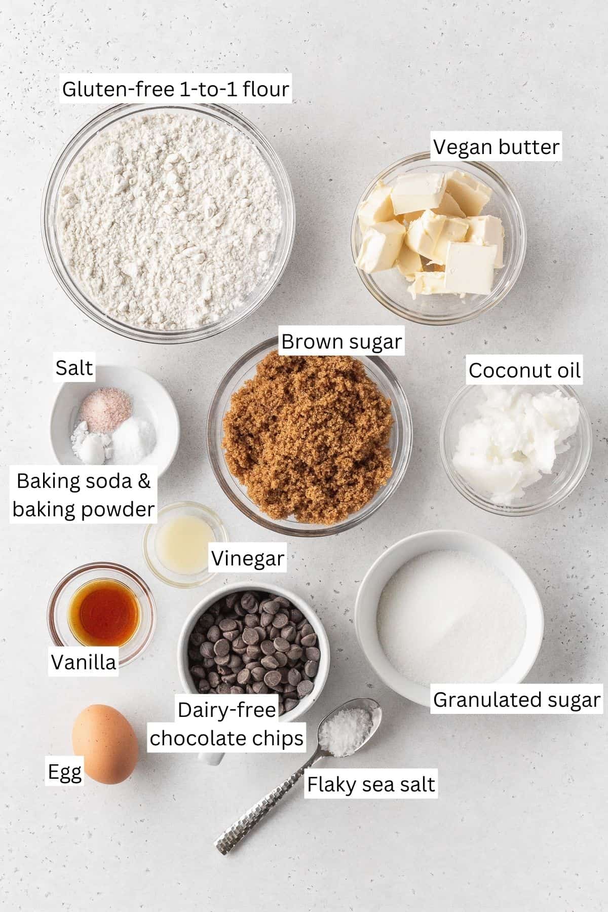 ingredients for making gluten-free dairy-free chocolate chip cookies laid out on a table with text overlay.