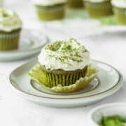 Matcha cupcake with white chocolate frosting on a plate