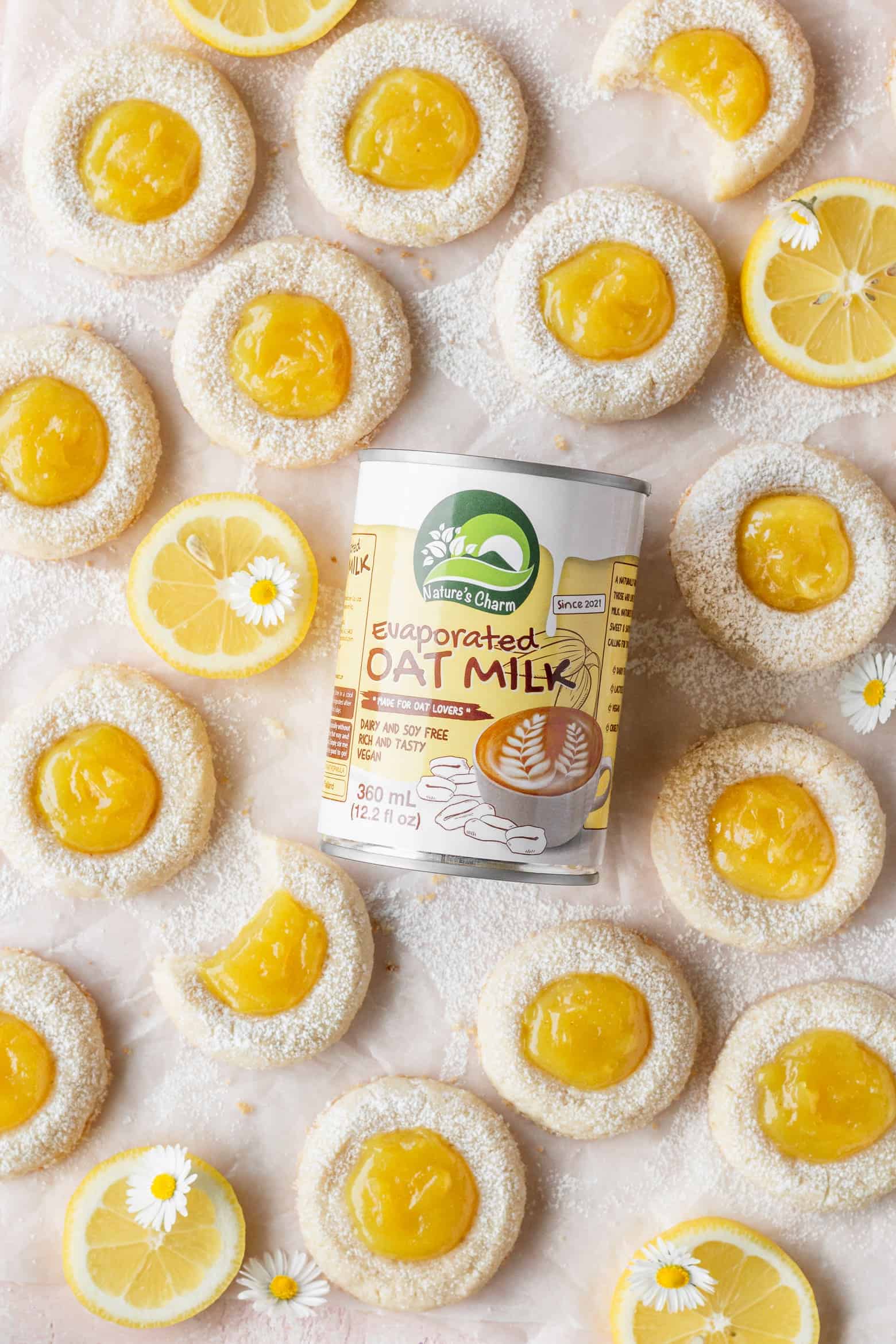 A can of Nature's Charm evaporated oat milk with lemon cookies.