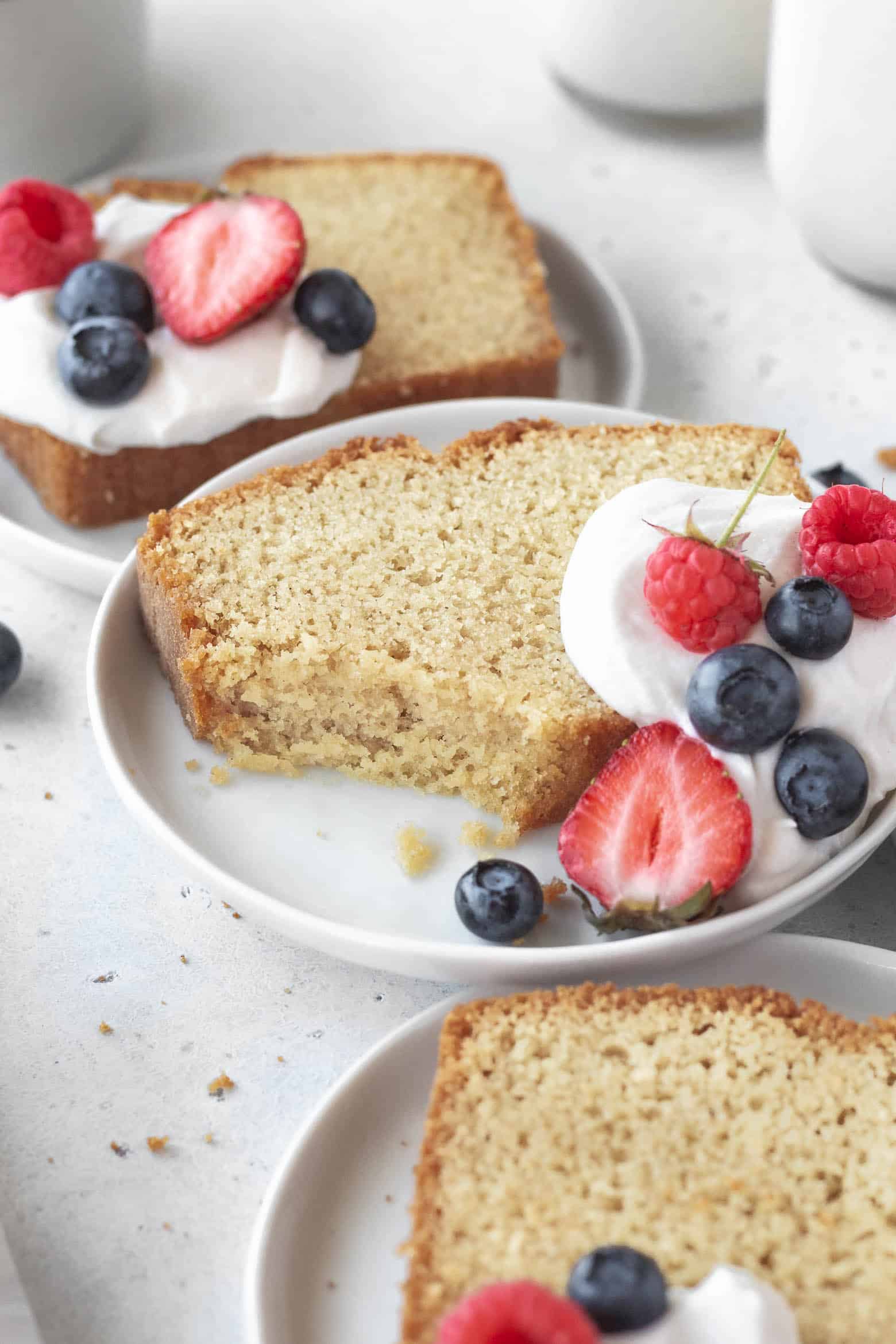 Tender gluten free pound cake on a plate.