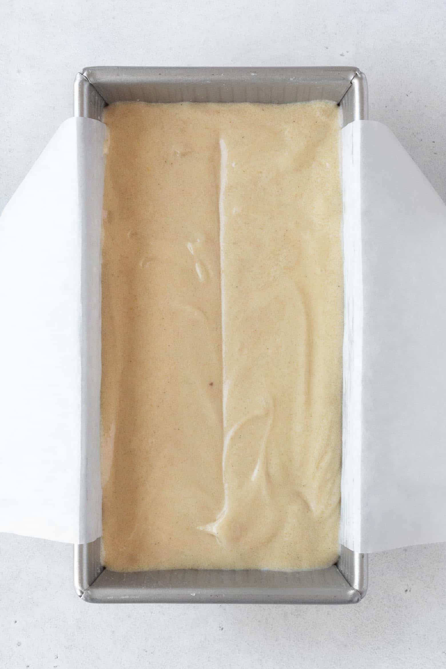Pour the cake batter in a parchment paper lined loaf pan.