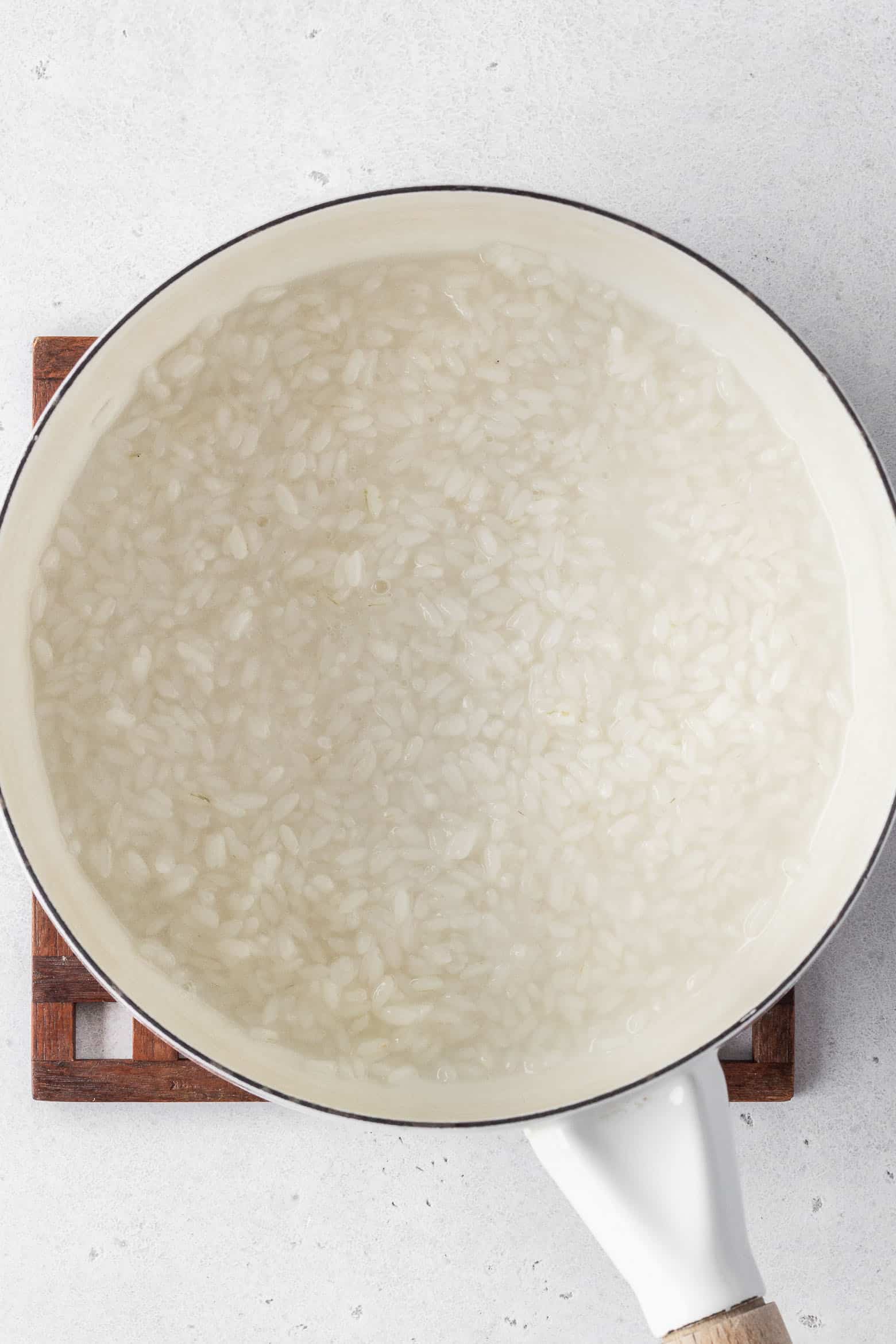 A pot of partially cooked rice