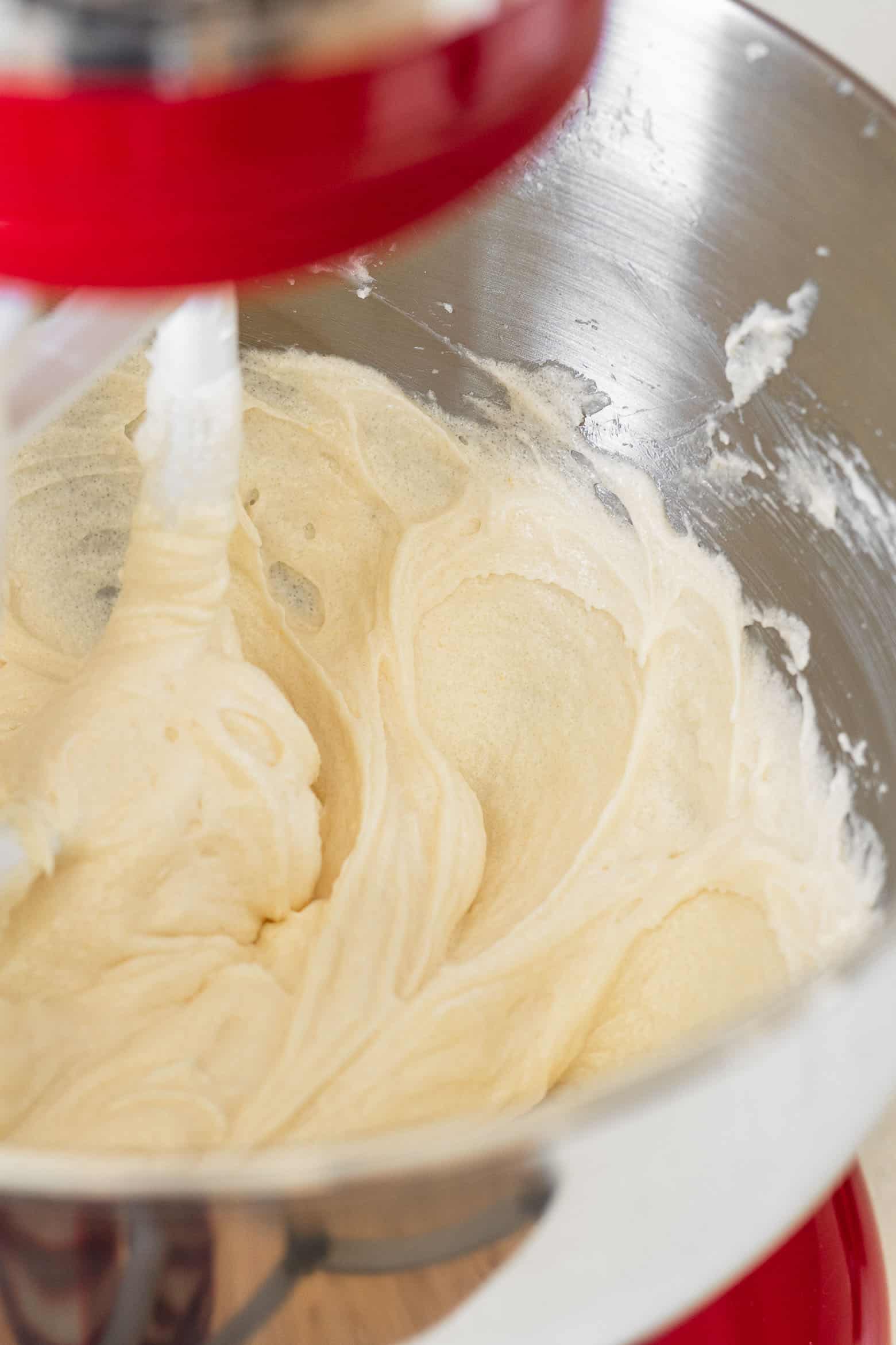 Add an egg to the creamed butter and beat together.
