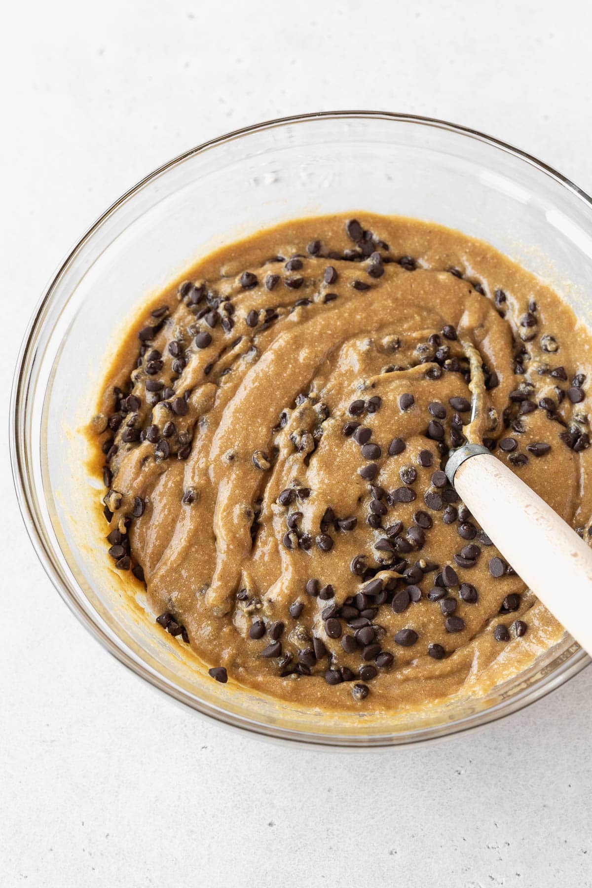 Step 3 for making dairy-free edible cookie dough — whisking in mini chocolate chips.