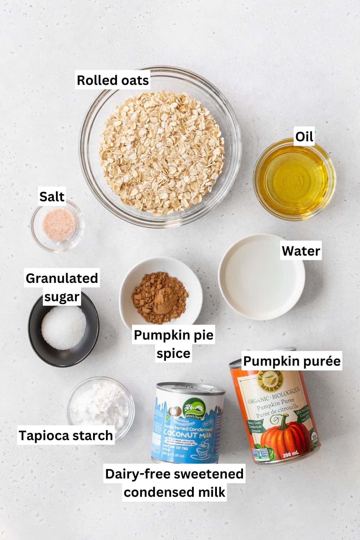 Ingredients for vegan pumpkin pie measured out into bowls with text overlay.