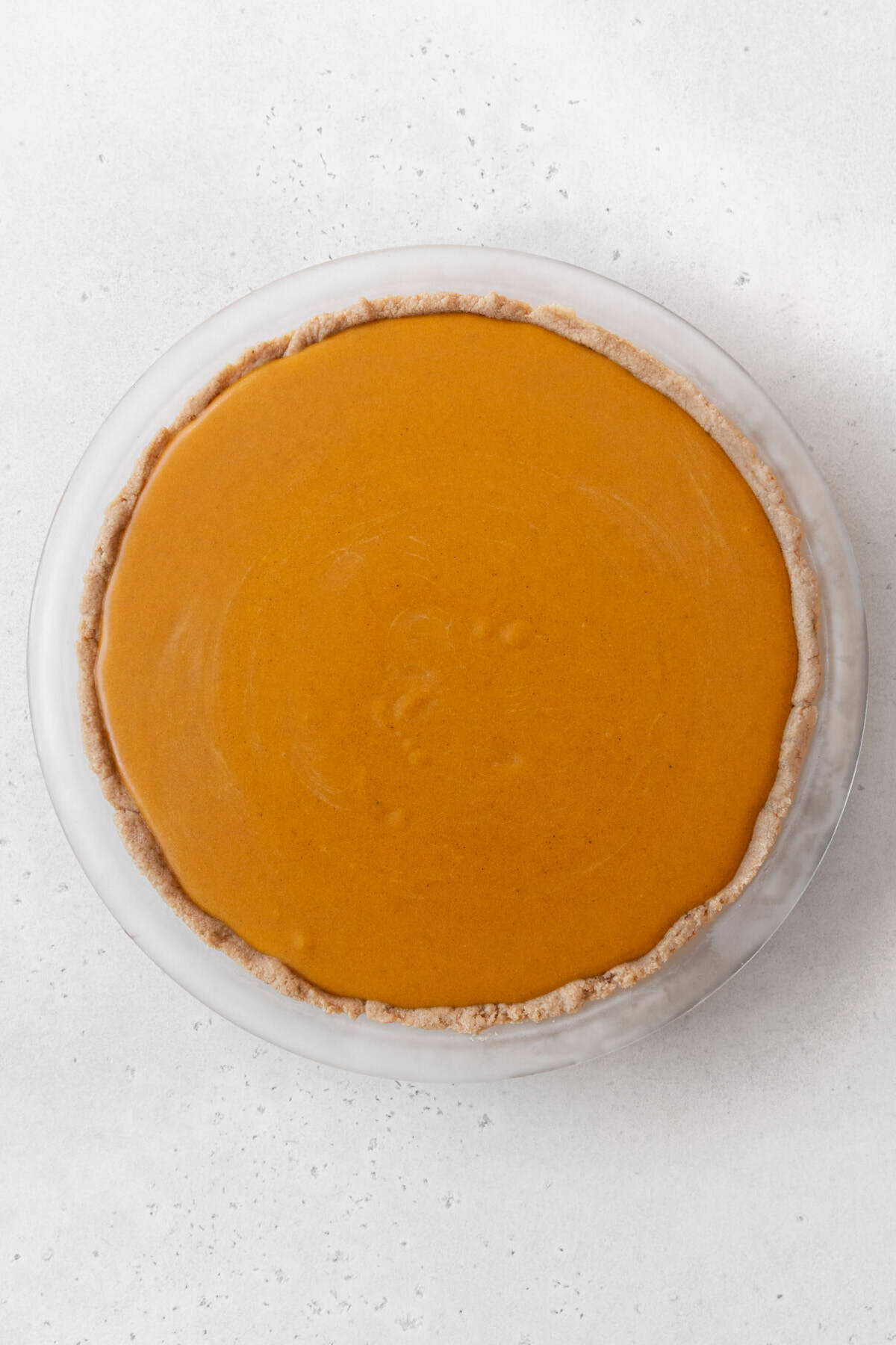 Eggless pumpkin pie before baking in the oven.
